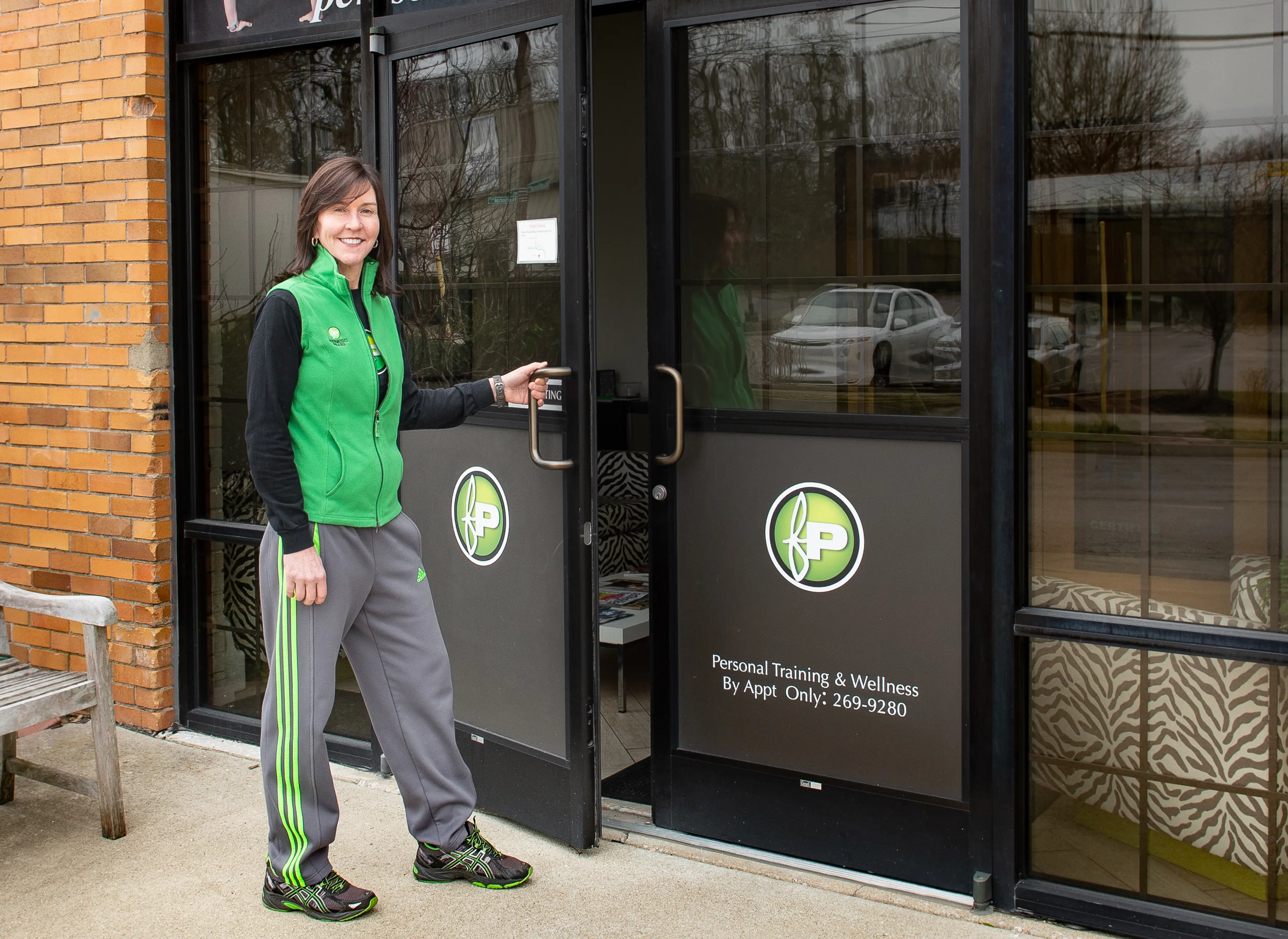 Sheila Kalas stands in front of the Fitness Plus Personal Training Studio